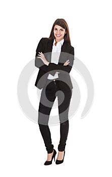 Businesswoman Standing Arms Crossed Over White Background