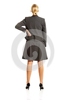 Businesswoman standing back in confident pose