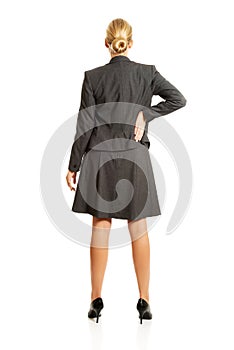 Businesswoman standing back in confident pose