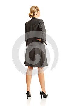 Businesswoman standing back in confident pose