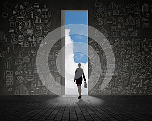 Businesswoman standing at the exit