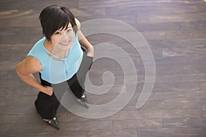 Businesswoman standing indoors smiling