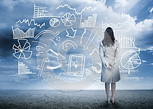 Businesswoman standing looking at data flowchart