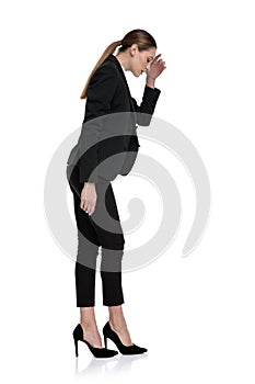 Businesswoman standing and looking down worried