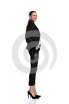 Businesswoman standing and waiting in line while looking at camera