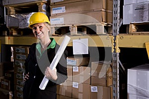 Businesswoman in storage warehouse
