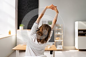 Businesswoman Stretching Her Arms