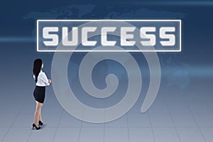 Businesswoman and success concept on blue world map