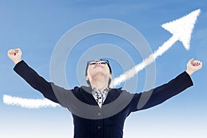 Businesswoman success gesture with up arrow cloud