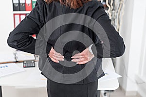 Businesswoman suffering from back pain
