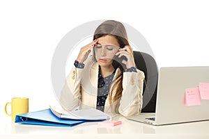 Businesswoman suffering stress at office computer desk looking worried depressed and overwhelmed