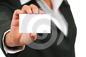 Businesswoman in suit holding empty business card