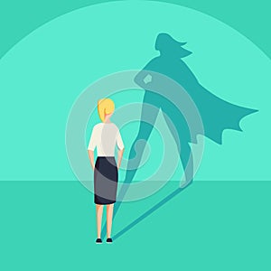 Businesswoman with superhero shadow concept. Business symbol of emancipation ambition and success motivation.