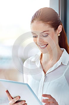 Businesswoman, tablet and smile in workplace for market research, development and networking. Technology, online and