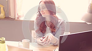 Businesswoman taking break and having fun playing with slinky.