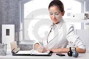 Businesswoman taking notes