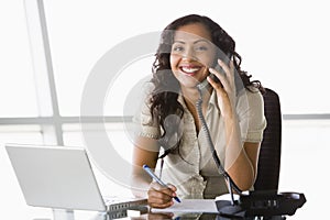 Businesswoman taking telephone call