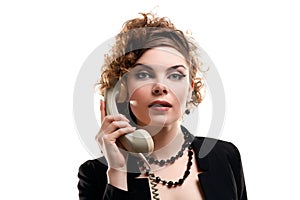 Businesswoman taking telephone call in office