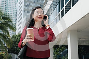 Businesswoman Talking On Cell Phone And Commuting