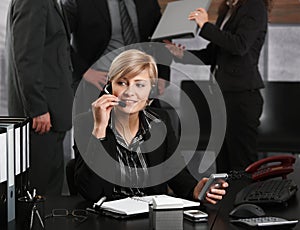 Businesswoman talking on headset