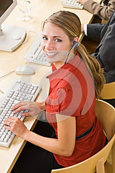 Businesswoman talking on headsets