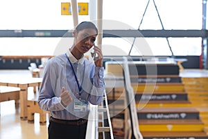 Businesswoman talking on mobile phone in a modern office