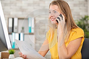 businesswoman talking on phone in office