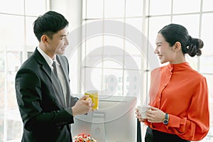 Businesswoman talking to colleague in office