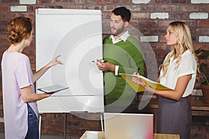 Businesswoman talking to colleagues