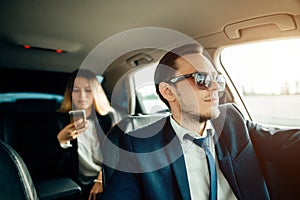 Businesswoman Talking Using Phone Car Inside