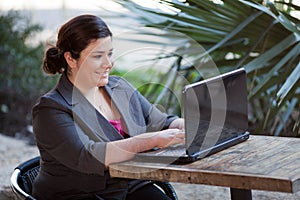 Businesswoman - Telecommuting from Internet Cafe photo