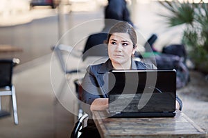 Businesswoman - Telecommuting from Internet Cafe photo