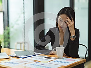 Businesswoman thinking and stressing out about business plan photo