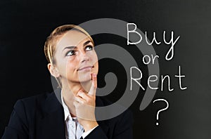 Businesswoman Thinking To Choose Buy Or Rent