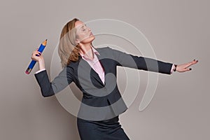 Businesswoman throwing pencil