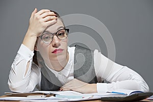 A businesswoman tired head on a hand