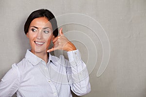 Businesswoman toothy smile and gesturing call