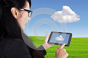 Businesswoman and touch pad, cloud computing concept
