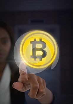 Businesswoman touching bitcoin graphic icon photo