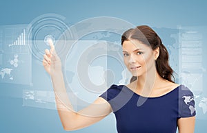 Businesswoman touching virtual screen