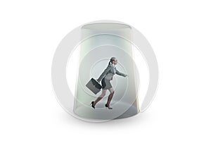 Businesswoman trapped in transparent glass