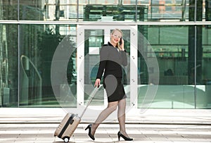 Businesswoman traveling and calling with mobile phone