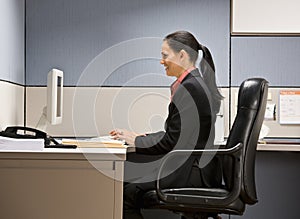 Businesswoman typing on computer