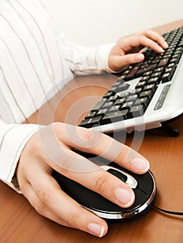 Businesswoman typing in the computer