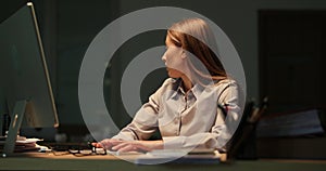 Businesswoman typing on computer keyboard during thunderstorm 4k movie slow motion