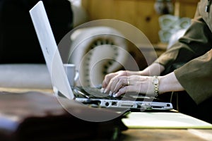 Businesswoman Typing in Hotel Atrium