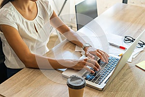 Businesswoman typing on laptop at workplace Woman working in home office hand keyboard