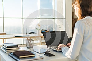 Businesswoman typing on laptop at workplace Woman working in home office hand keyboard