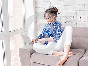 Businesswoman typing on laptop at workplace Woman working in home office hand keyboard.