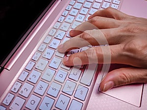 Businesswoman typing on laptop at workplace Woman working in home office hand keyboard.